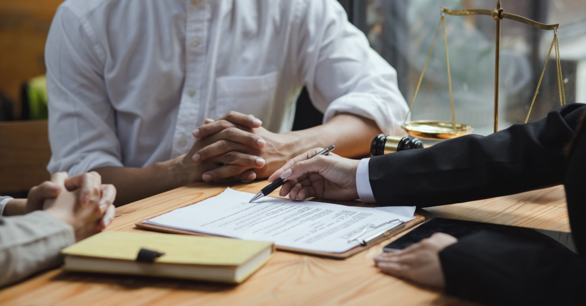 law firm attorney and client discussing contract