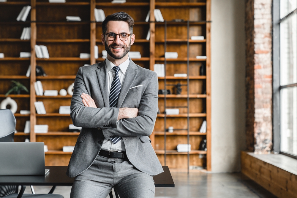 Portrait,Of,Young,Rich,Businessman,In,Formal,Suit,With,Arms young successful businessman smiling confidently